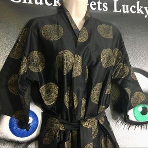 Black and gold robe , os